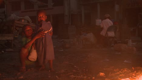 An-open-fire-burns-on-the-streets-of-Haiti-following-an-earthquake-1