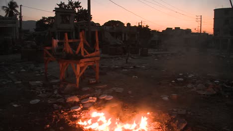 An-open-fire-burns-on-the-streets-of-Haiti-following-an-earthquake-2