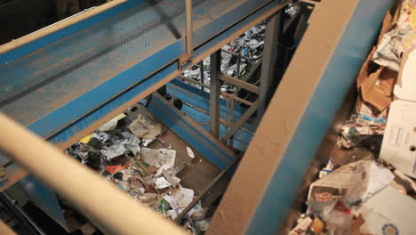 Recycling-materials-travel-on-conveyor-belts-in-a-recycling-center