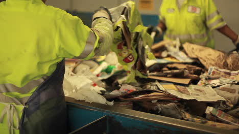 Workers-sort-trash-at-a-recycling-center-1