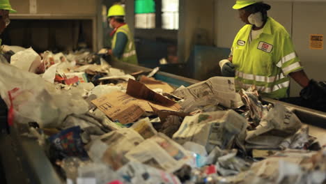 Workers-sort-trash-at-a-recycling-center-2