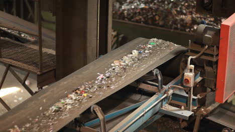 Recycled-materials-travel-on-a-conveyor-belt-at-a-recycling-center