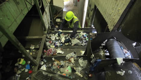 High-angle-view-of-workers-sorting-trash-at-a-recycling-center-1