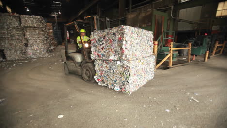 A-skip-loader-moves-aluminum-cans-at-a-recycling-center