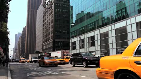 Yellow-cabs-buses-and-other-traffic-pass-on-a-busy-street-in-New-York-City