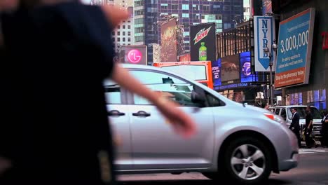 Pedestrians-pass-on-a-busy-street-in-New-York-City-1