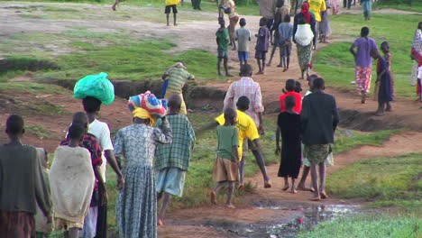 Longshot-of-African-children-run-down-a-country-road-1