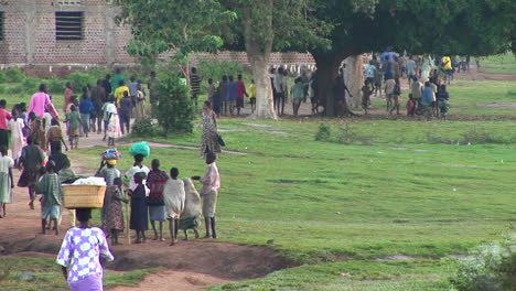 Longshot-of-African-children-run-down-a-country-road-2