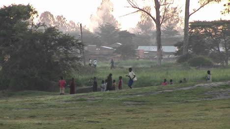 A-boy-runs-near-a-village-in-Uganda