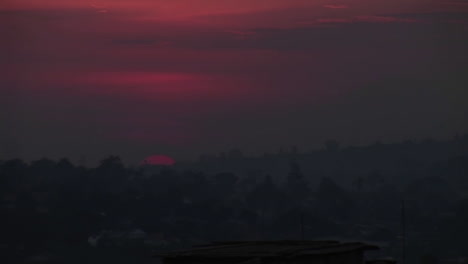 Time-Lapse-shot-of-a-fiery-sun-setting-over-Kampala-Uganda