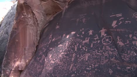 Panright-across-ancient-American-Indian-petroglyphs-at-Newspaper-Rock-Utah